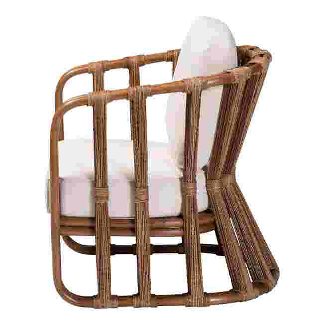 Side view of rattan armchair with white cushion