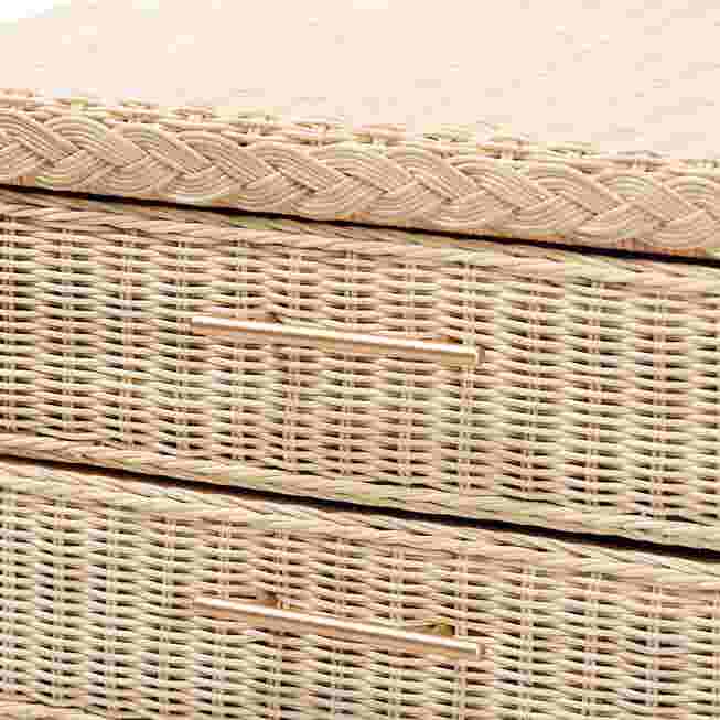 Close-up of the woven rattan texture and drawer handles