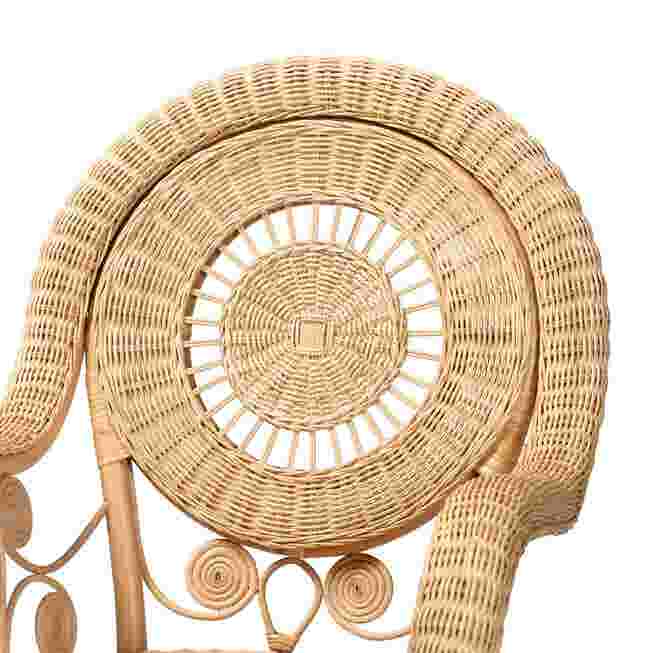 Close-up of circular woven backrest of rattan chair
