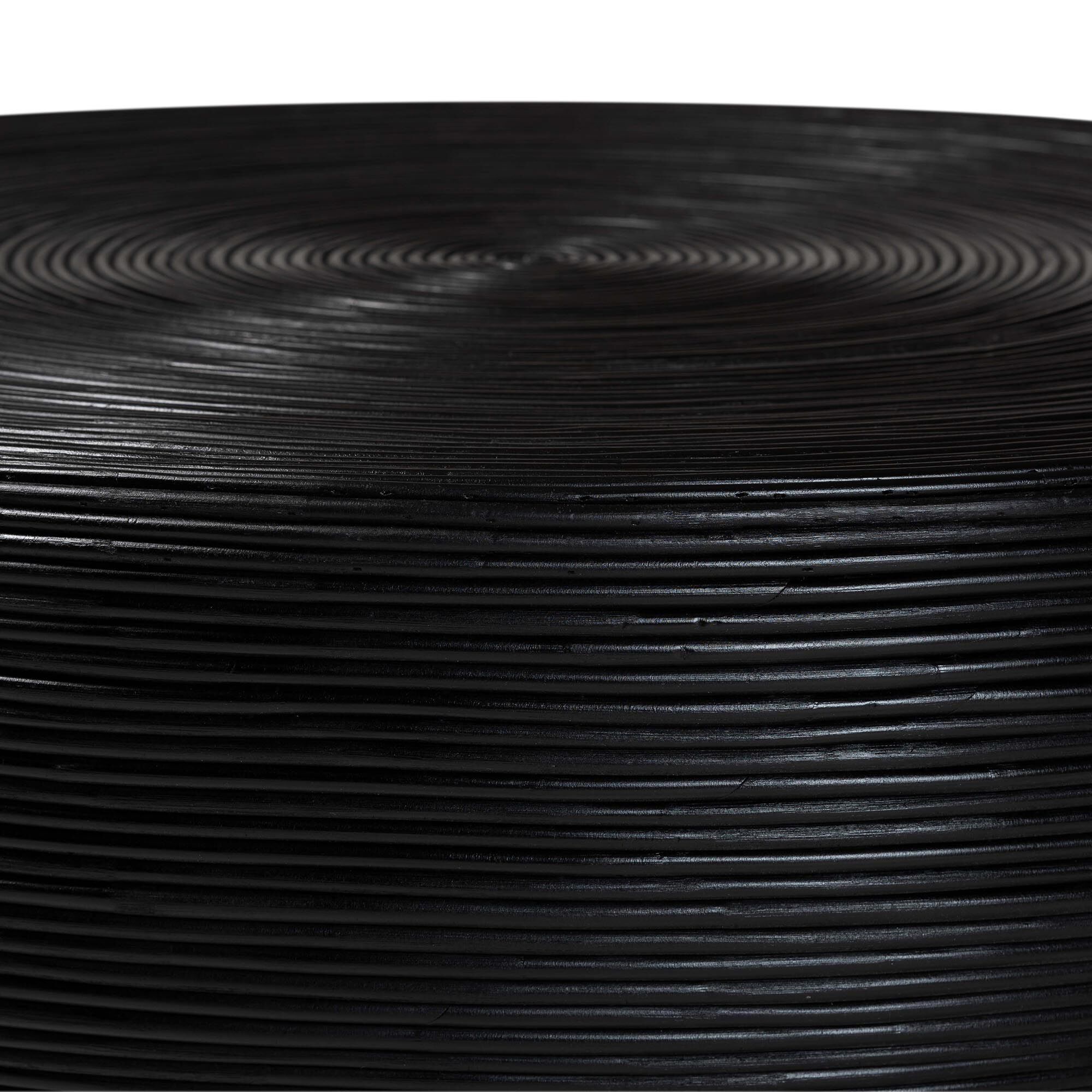 Close-up of black concentric rattan strip pattern on coffee table