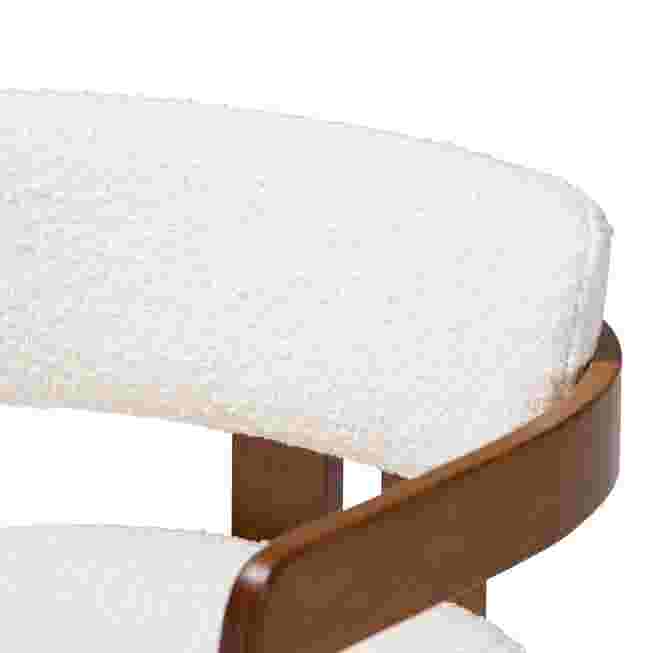 Close-up of cream boucle seat and wooden frame