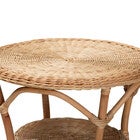 Close-up side view of round rattan coffee table top and lower shelf