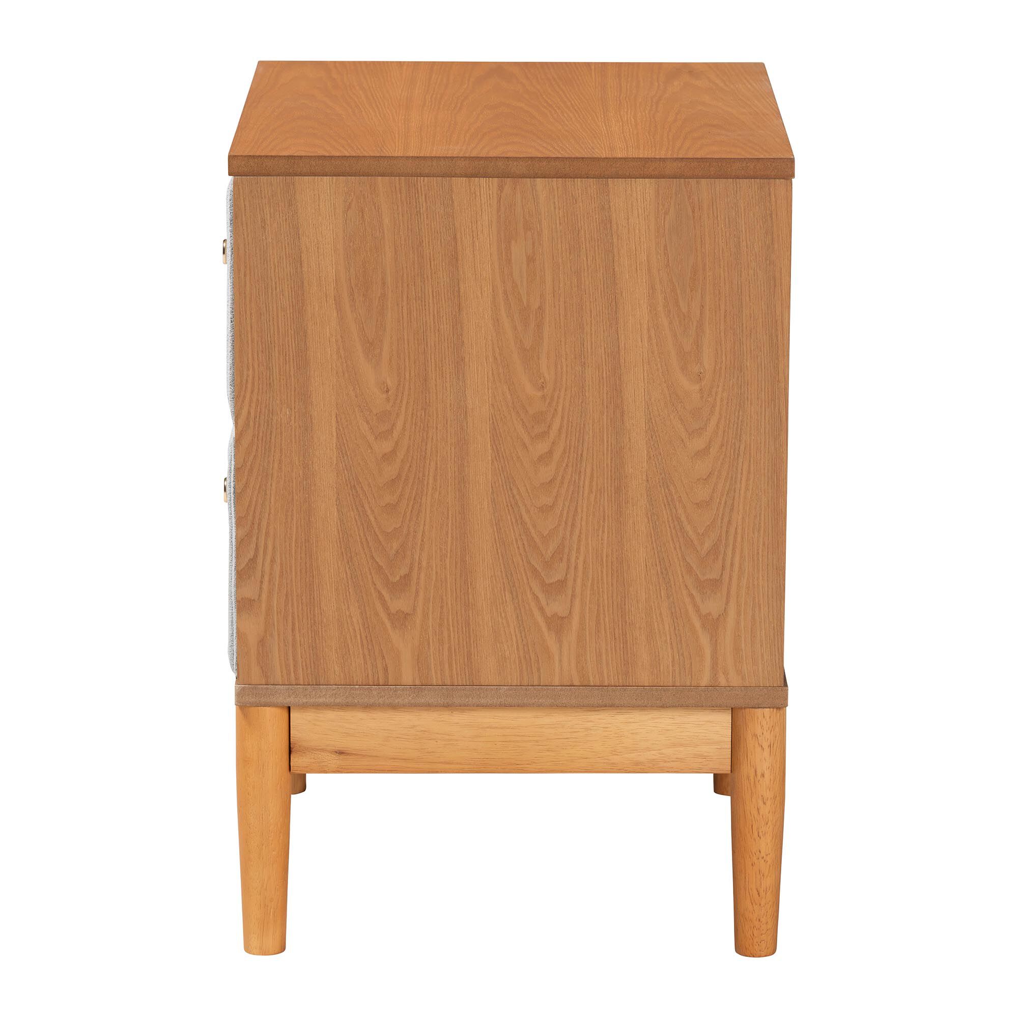 Side view of a grey corduroy nightstand with oak wood frame