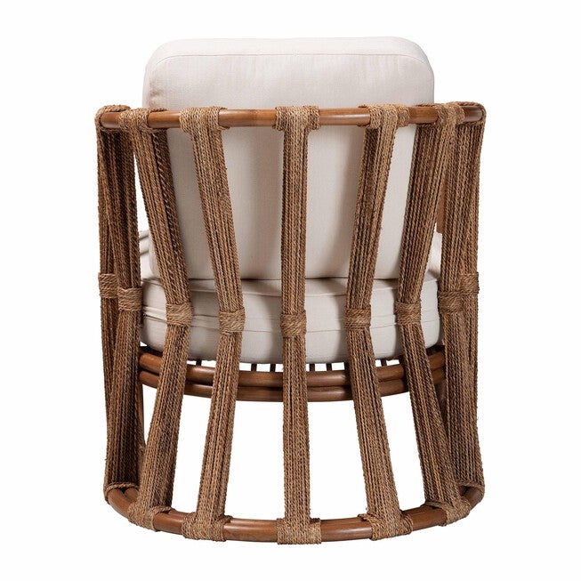 Rear view of woven rattan arm chair with white cushions