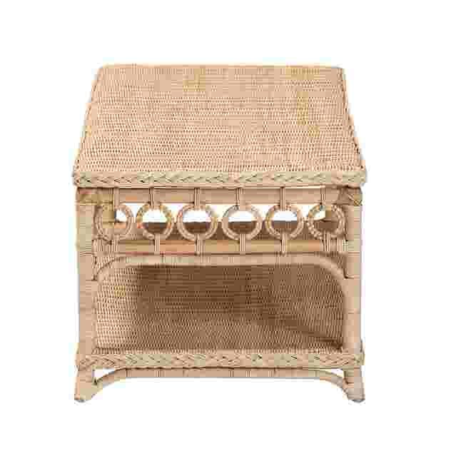 Natural rattan coffee table with a rectangular top and decorative cutouts, shown against a white background.
