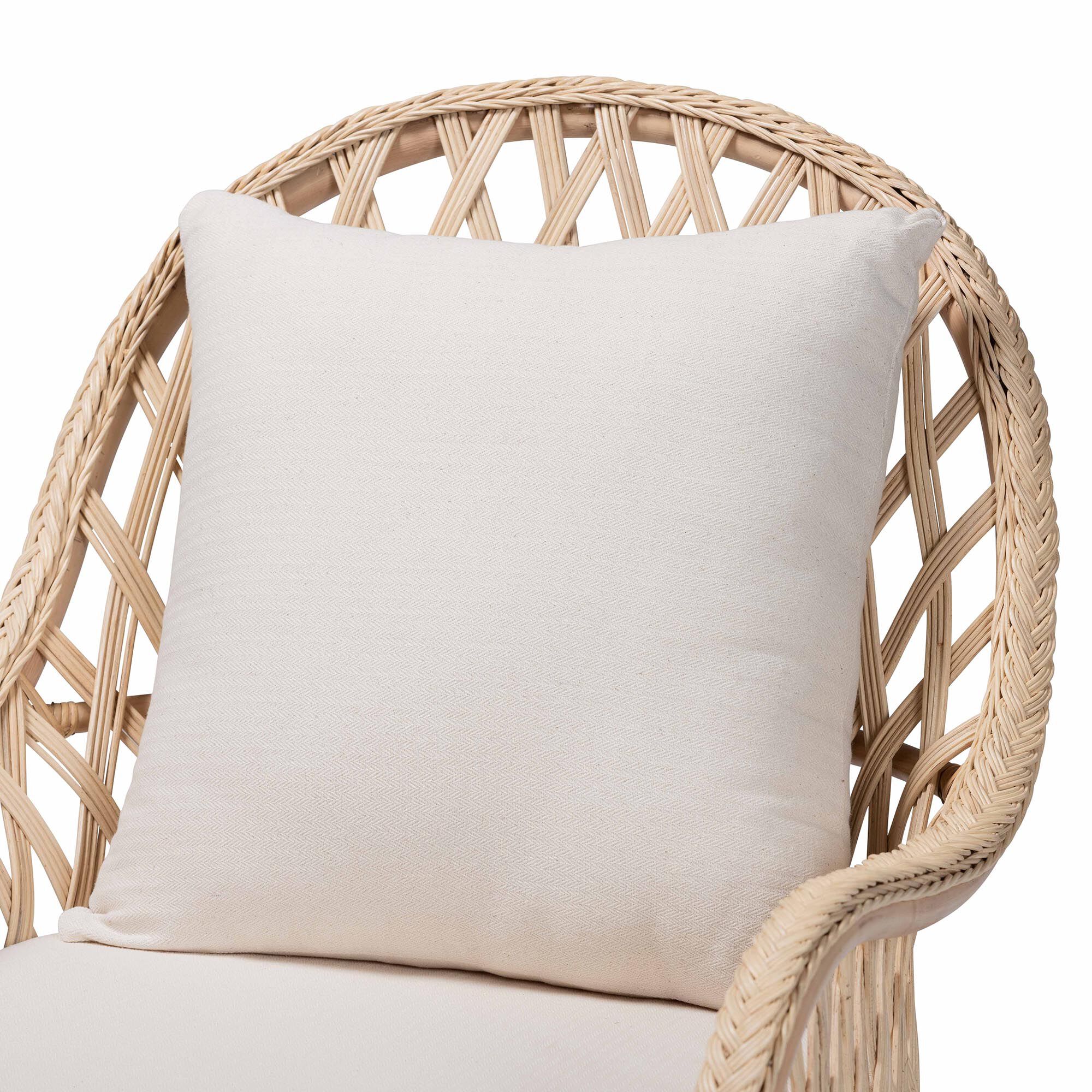 Cushion against backrest of rattan arm chair