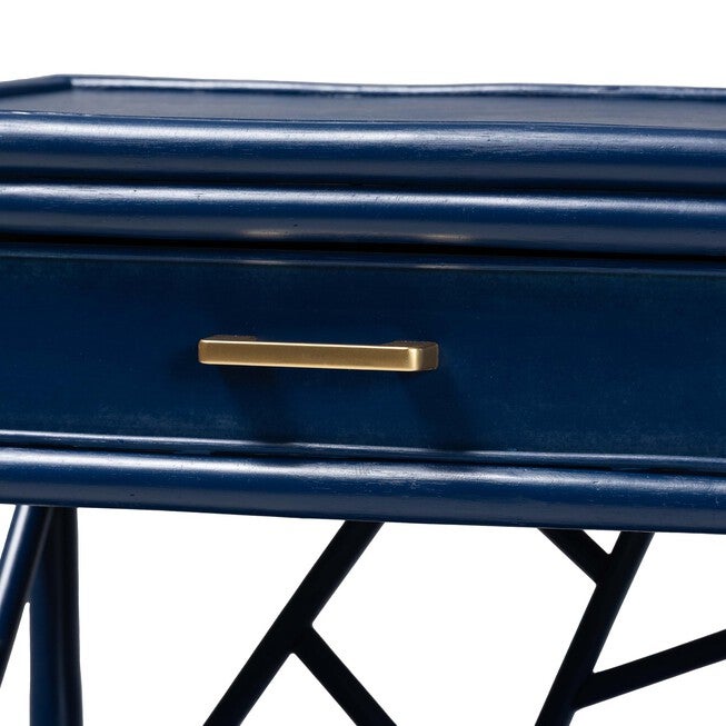 Gold bar handle on blue nightstand drawer