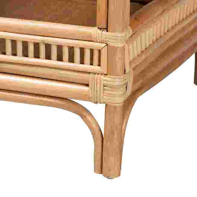 Close-up of the leg and frame of a rattan coffee table.
