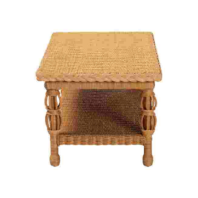 Natural rattan coffee table with a woven top and lower shelf, shown against a white background.