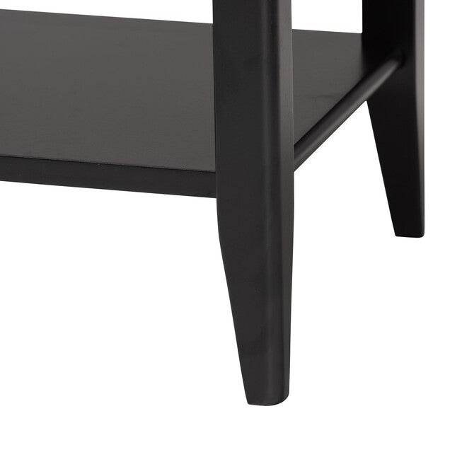 Tapered leg and lower shelf corner of black nightstand