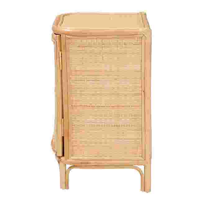 Side view of a rattan nightstand with a woven front panel.