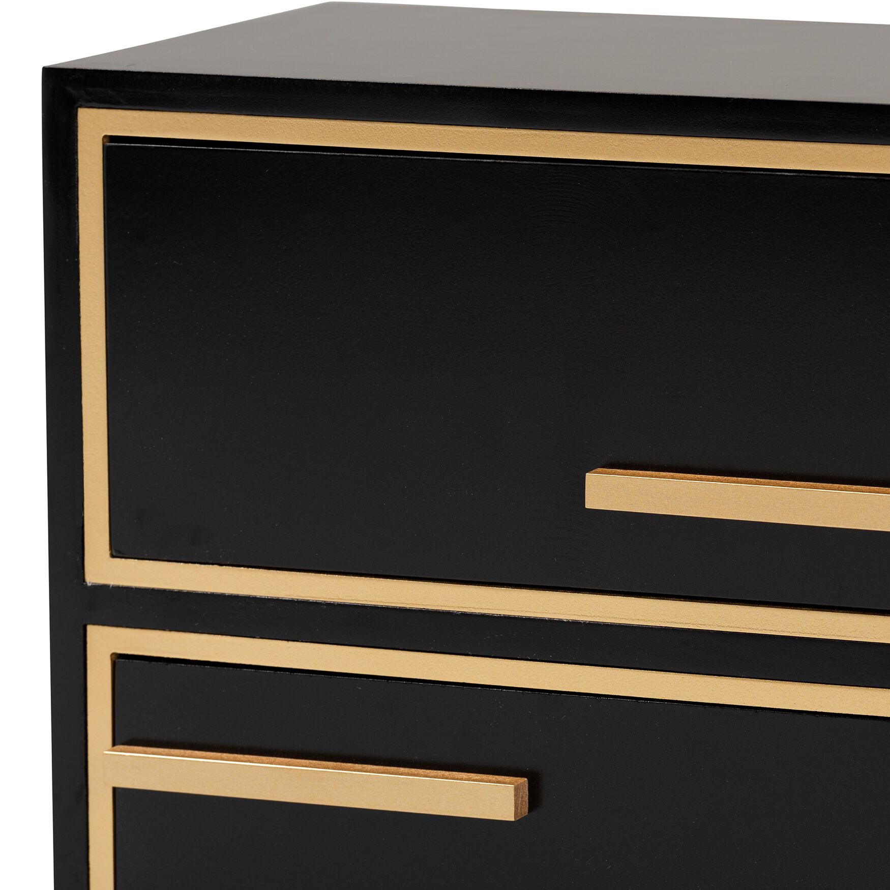 Close-up of gold trim and drawer front on black nightstand
