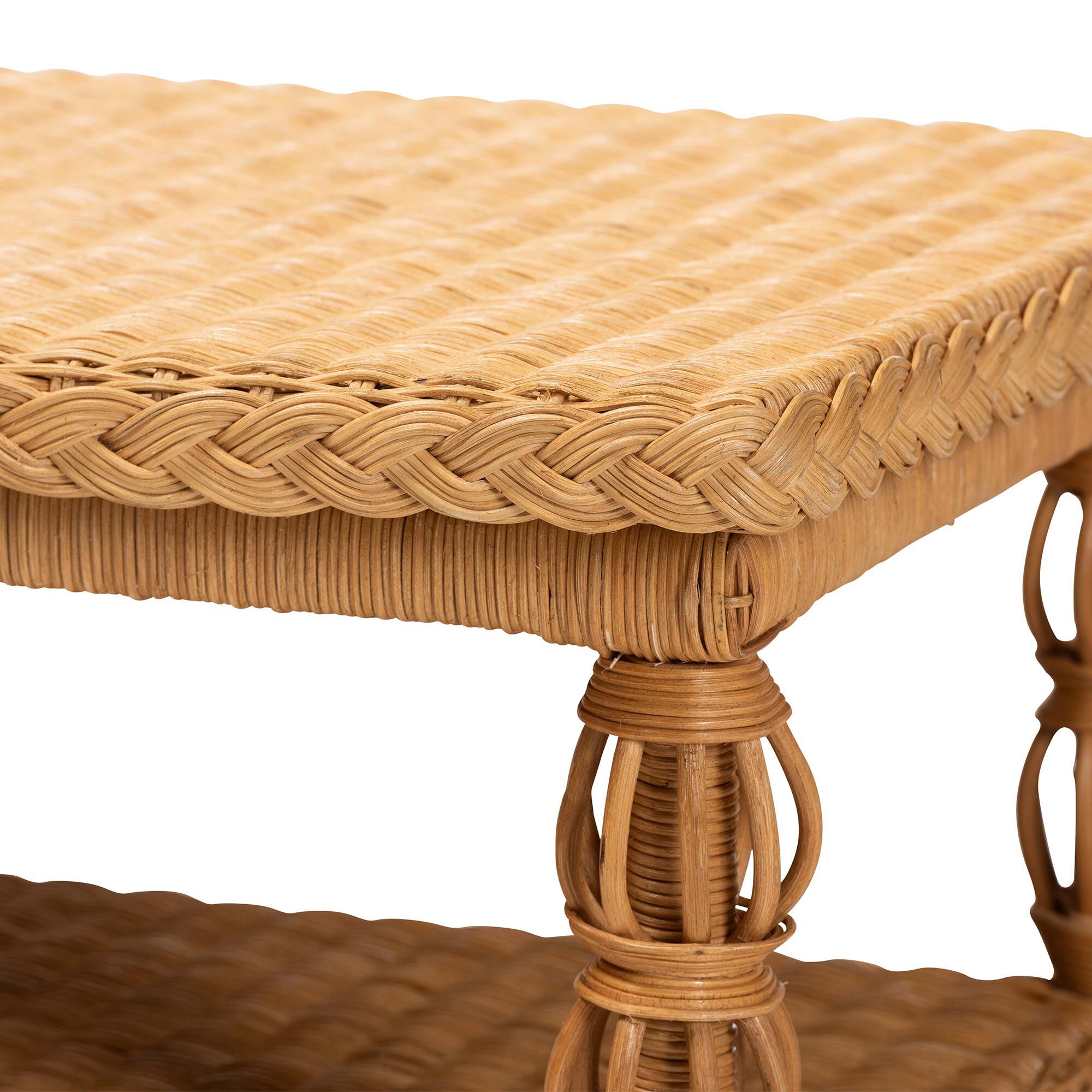 Close-up of the woven top and leg of the rattan coffee table.