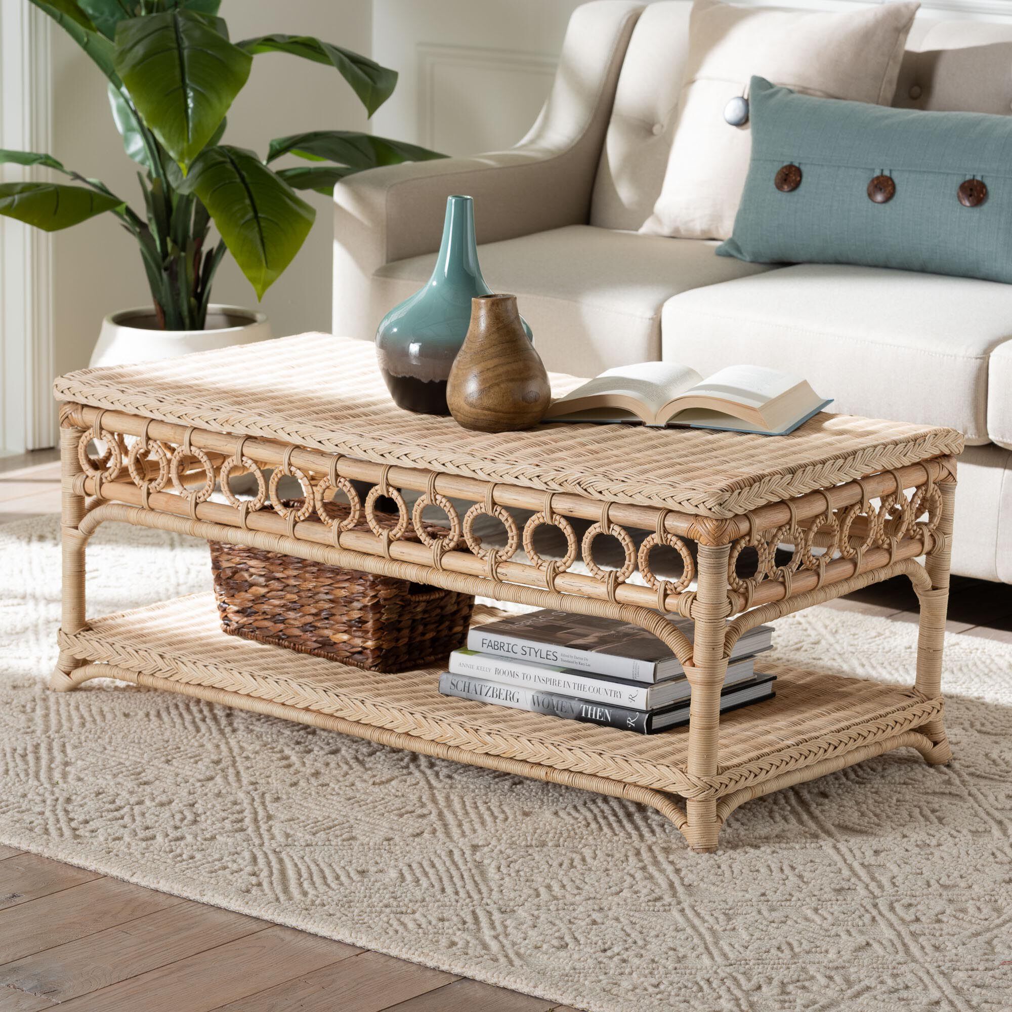 Natural rattan coffee table with ring trim in living room setting