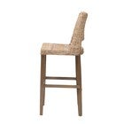 Side view of rattan bar stool with wooden legs and footrest.