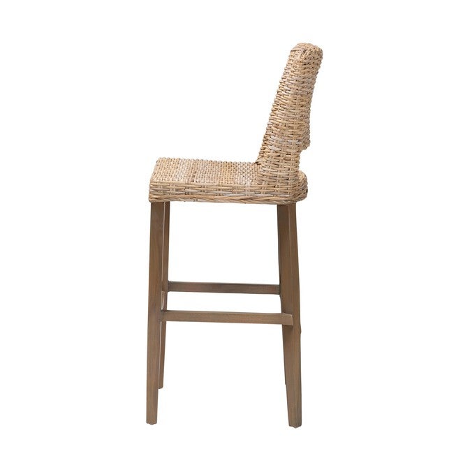 Side view of woven rattan bar stool on mahogany legs.