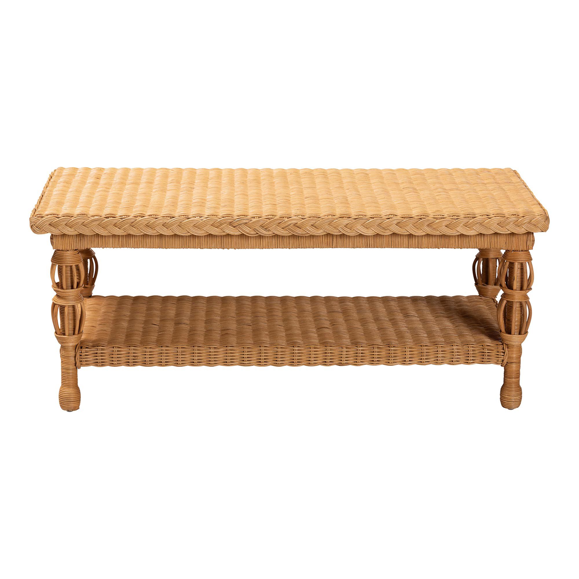 Natural rattan coffee table with a woven top and lower shelf, shown against a white background.