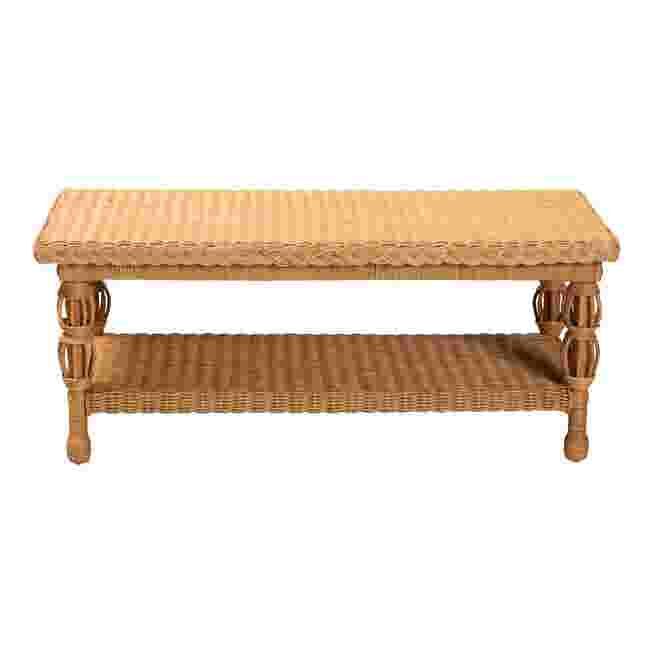 Natural rattan coffee table with a woven top and lower shelf, shown against a white background.