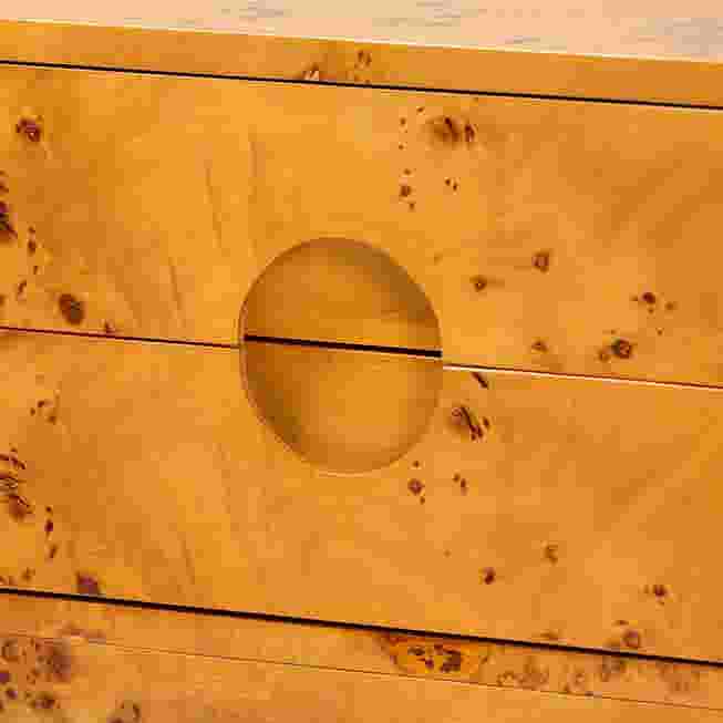 Close-up of the circular handle on the drawer front.