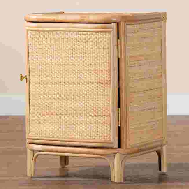 Rattan nightstand with a woven front panel, placed on a wooden floor.