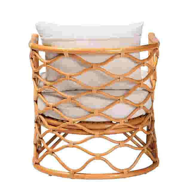 Back view of light honey rattan arm chair with white cushion