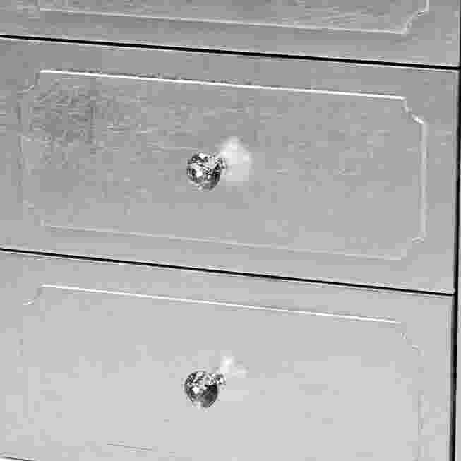 Close-up of drawer front knob and trim