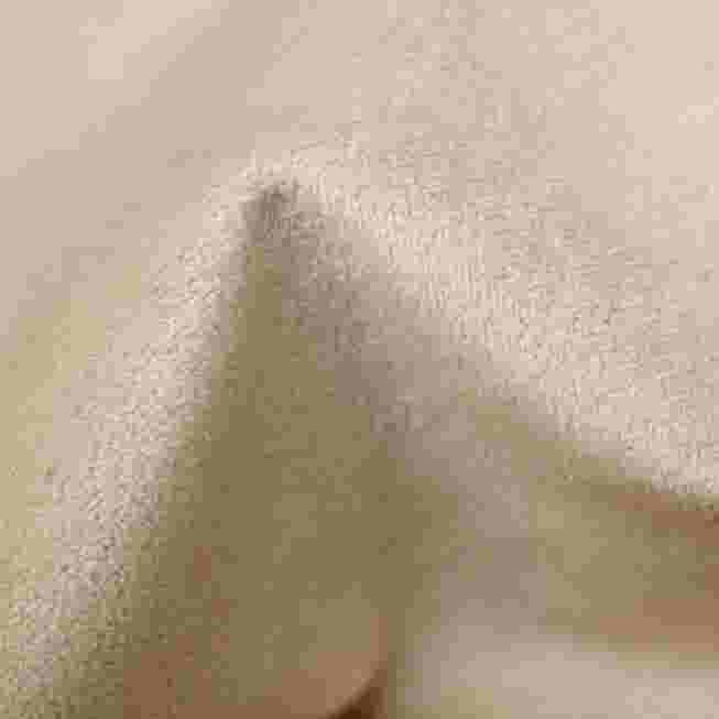 Close-up of the fabric texture of the stool seat