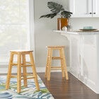 Natural wood round seat bar stool in kitchen interior