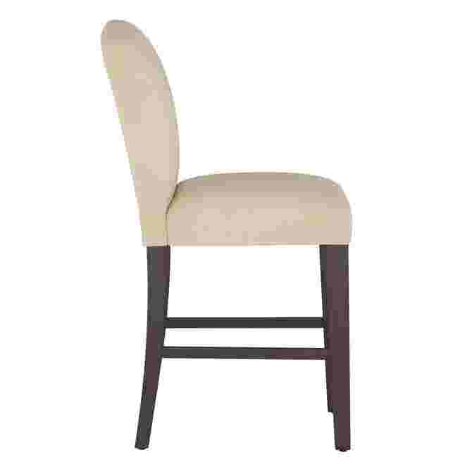 Velvet back counter stool with dark wooden legs and cream upholstery