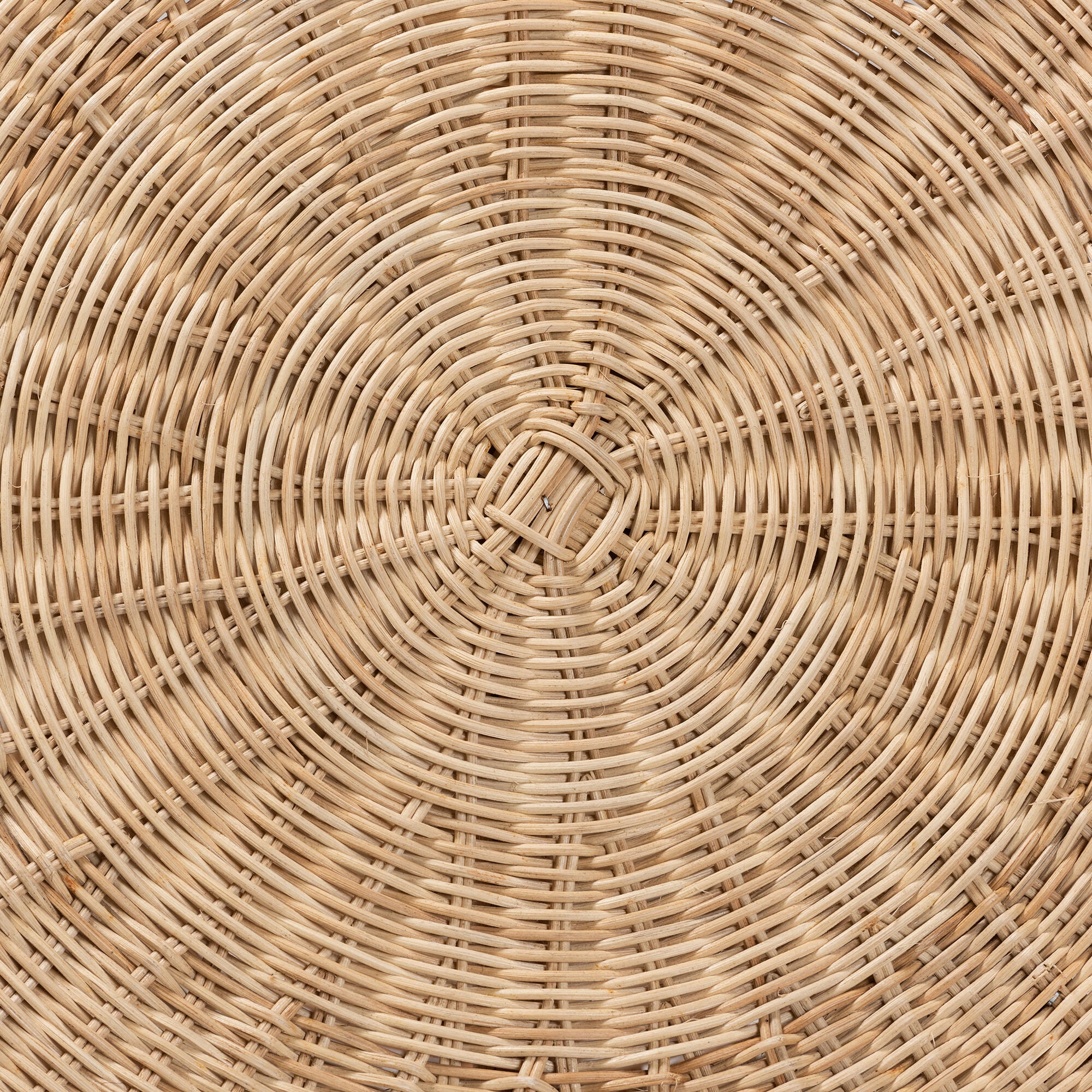 Tightly woven radial rattan pattern close-up