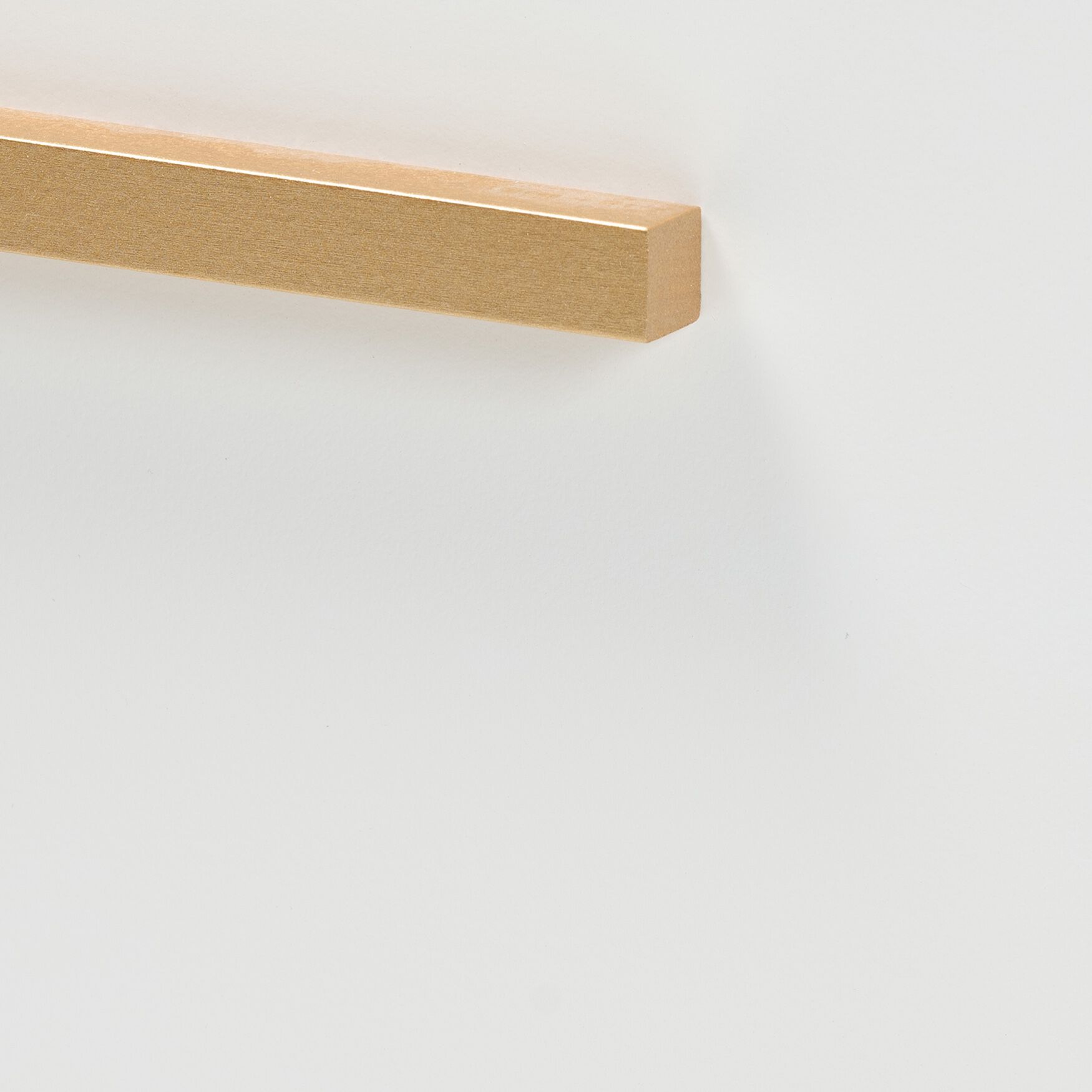 Close-up of a gold metal drawer handle