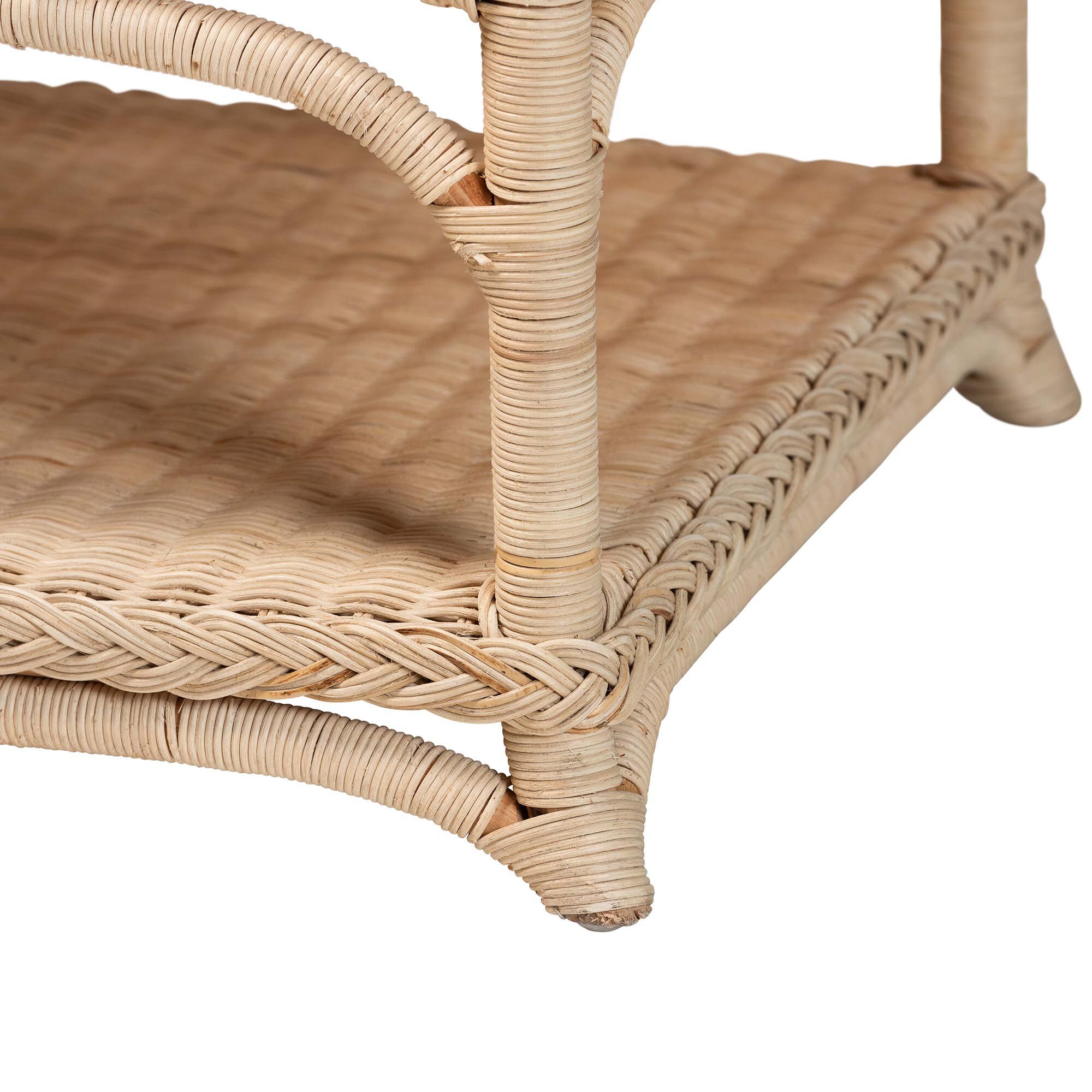Close-up of natural rattan coffee table corner with woven shelf edge