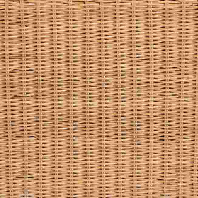 Close-up of the woven texture of a light honey rattan coffee table