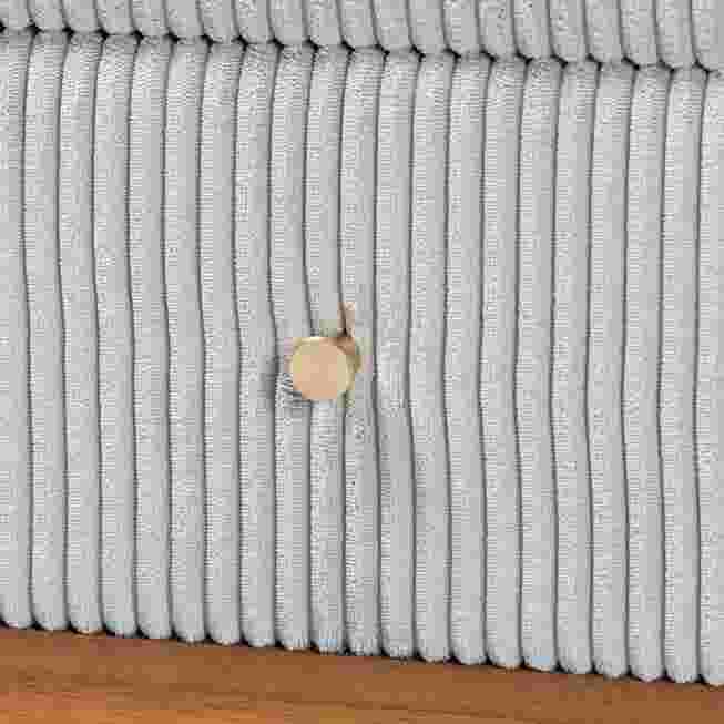 Close-up of the corduroy texture and knob on the nightstand drawer