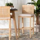 Sofia rattan bar stools with plant and furniture in a dining area