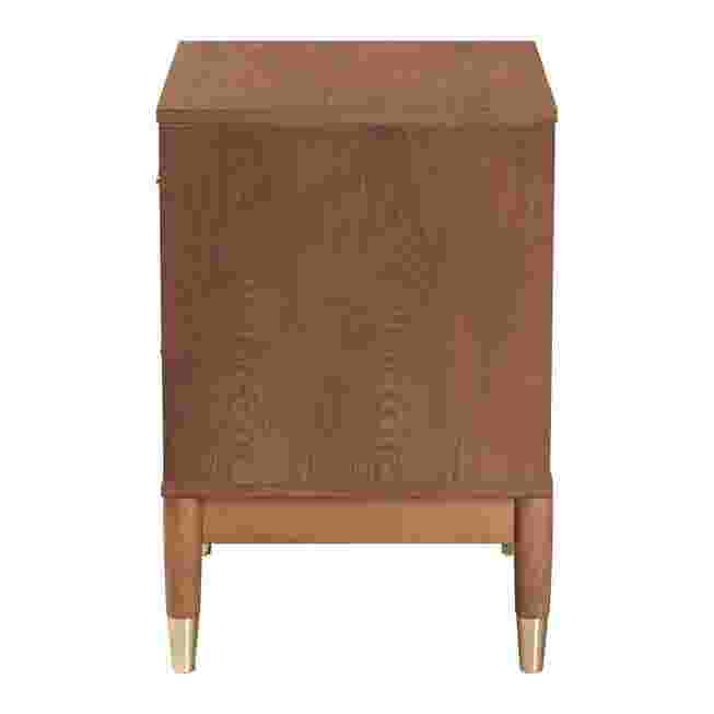 Side view of a wooden nightstand with metal feet