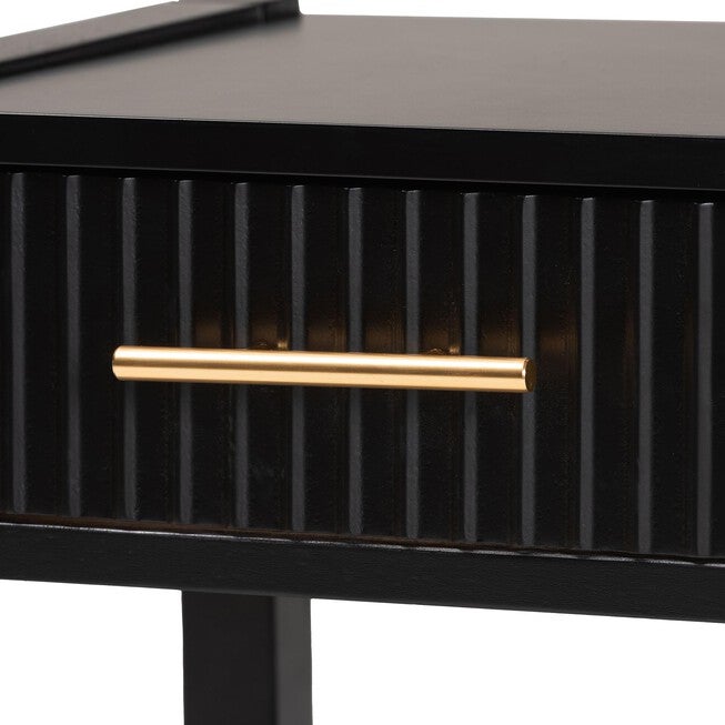 Close-up of gold bar handle on black fluted drawer