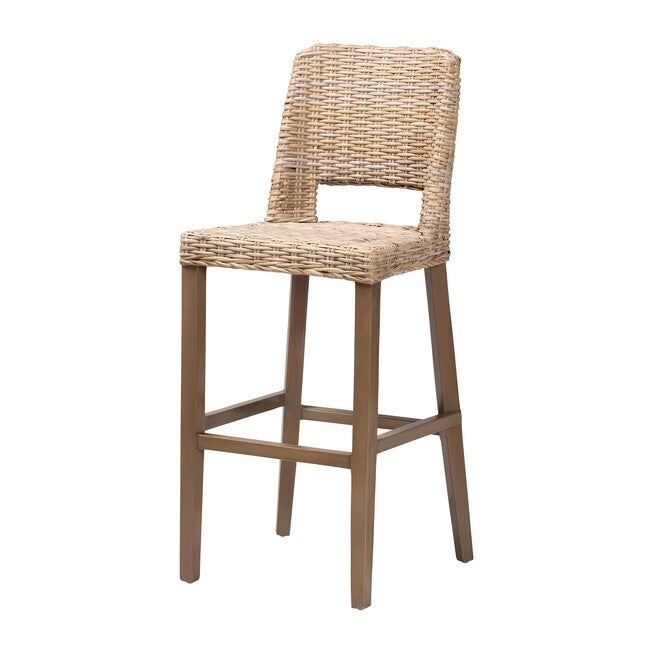 Front three-quarter view of rattan and mahogany bar stool with ladder footrest.