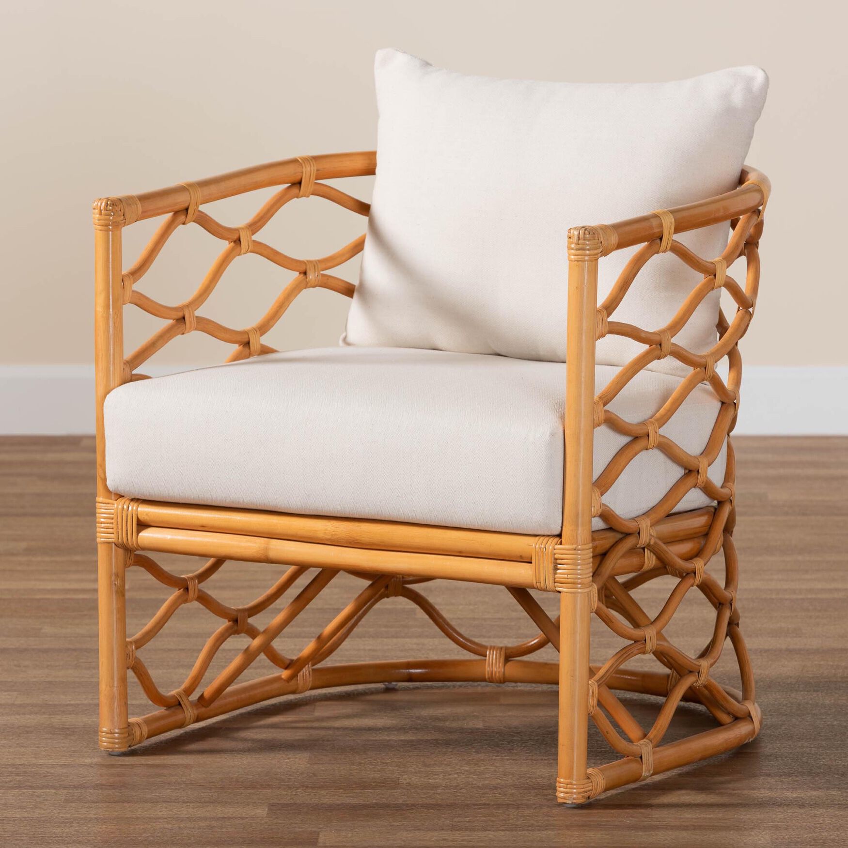 Light honey rattan arm chair with white cushion on wooden floor