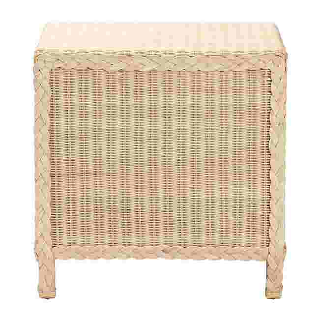 Front view of a sun bleached rattan nightstand