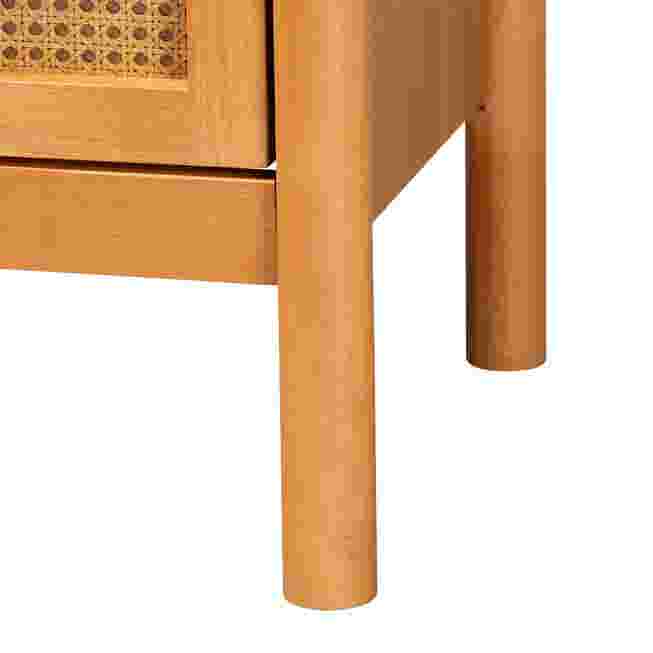 Close-up of tapered leg and drawer frame on golden brown nightstand