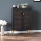 Side view of Rolliston two-door bar cabinet showing front with woven panels and gold legs