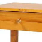 Close-up of circular knob on top drawer of mappa burl wood nightstand