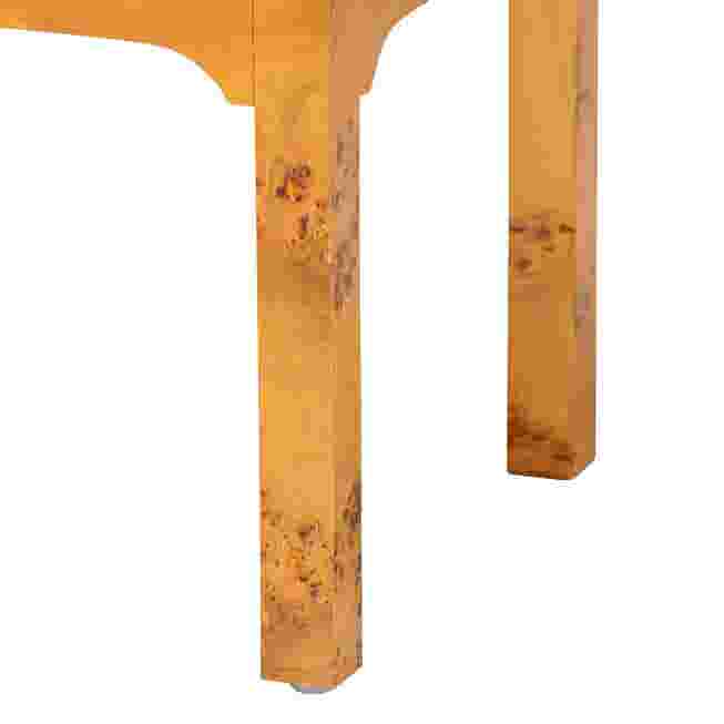 Close-up of the nightstand's leg, showing the wood grain and construction.