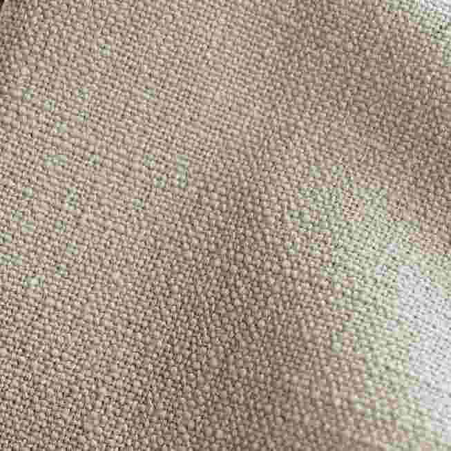 Close-up of fabric texture beige-brown linen