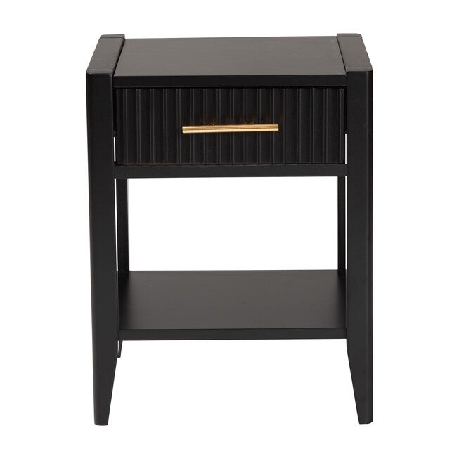 Front view of black mid-century nightstand with fluted drawer and gold bar pull