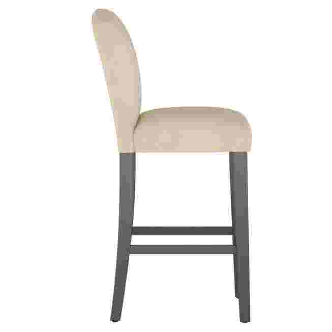 Side view of beige velvet camelback barstool