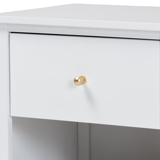 Close-up of white nightstand drawer with gold knob