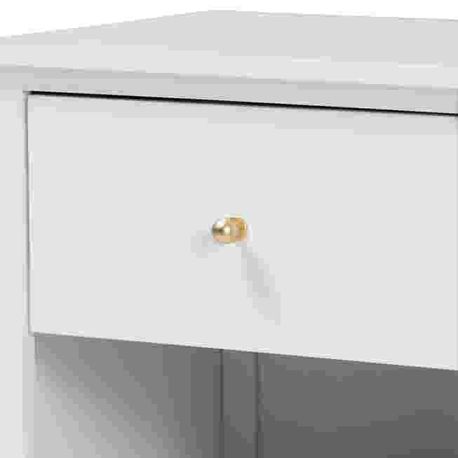 Close-up of white nightstand drawer with metallic pull