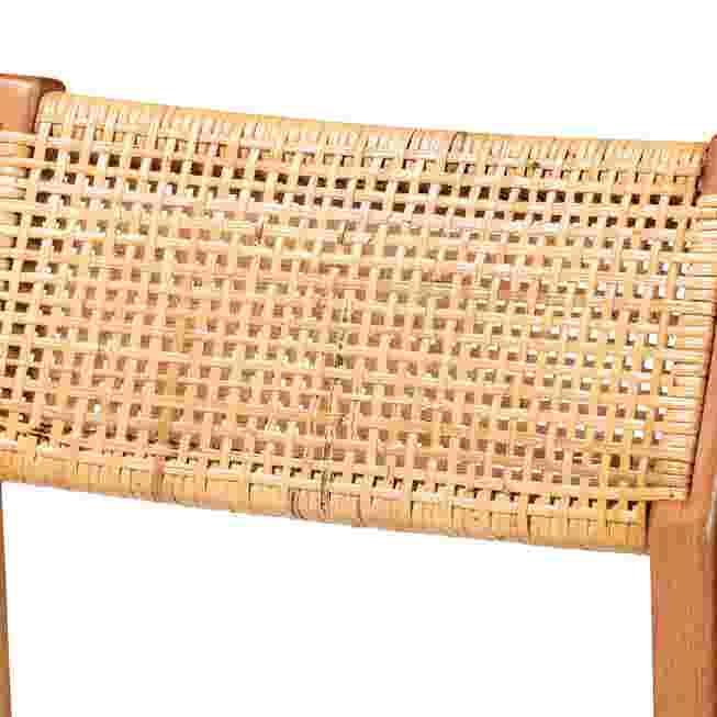 Close-up of woven cane back of a bar stool